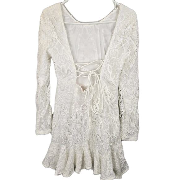 Showpo Dresses & Skirts - NWT Showpo Mini Lace Trim Open Tie Back White Dress Size 4 US Lace Long Sleeve